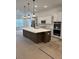 Modern kitchen with an island, stainless steel appliances, and pendant lighting at 586 Marsh Cove Cir, Summerville, SC 29486