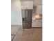 Kitchen with stainless steel refrigerator and white cabinets, perfect for cooking at 586 Marsh Cove Cir, Summerville, SC 29486