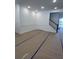 Bright living room with board and batten wall trim and stair case, offering a serene retreat at 586 Marsh Cove Cir, Summerville, SC 29486