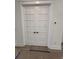 White french doors with glass panes lead to a home office at 586 Marsh Cove Cir, Summerville, SC 29486