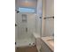 Modern walk-in shower with white subway tile, a built-in bench, and sleek glass enclosure at 586 Marsh Cove Cir, Summerville, SC 29486