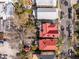 Aerial view of charming homes with red roofs, surrounded by lush greenery and lined streets at 6 Halsey St, Charleston, SC 29401