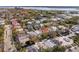 An aerial view shows a neighborhood with large houses and mature trees near the water at 6 Halsey St, Charleston, SC 29401