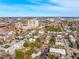 Aerial view featuring a cityscape with buildings, lush trees, and a distant bridge on a clear day at 6 Halsey St, Charleston, SC 29401