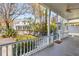 Inviting back porch with white railings and a spiral staircase, offering a relaxing outdoor space at 6 Halsey St, Charleston, SC 29401