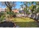An empty backyard features a simple lawn, outlined by an aged brick border, ready for landscaping at 6 Halsey St, Charleston, SC 29401