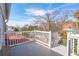 Balcony with white railings offers a serene outdoor space with views of trees and buildings in the background at 6 Halsey St, Charleston, SC 29401