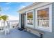 Balcony with bench seating offers a tranquil outdoor spot, featuring black door and views of the neighborhood at 6 Halsey St, Charleston, SC 29401