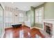 Elegant bathroom with a clawfoot tub, standing shower, and floral wallpaper at 6 Halsey St, Charleston, SC 29401