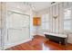 Well-appointed bathroom with a standing shower and a vintage clawfoot tub at 6 Halsey St, Charleston, SC 29401