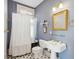 Bathroom with black and white tile, and a classic claw-foot tub at 6 Halsey St, Charleston, SC 29401