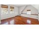 Cozy bedroom featuring hardwood floors, natural light from three windows and a clean, minimalist style at 6 Halsey St, Charleston, SC 29401