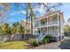 Charming two-story home featuring a spiral staircase, a quaint fenced yard, and double balconies at 6 Halsey St, Charleston, SC 29401