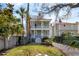 Two-story home with a beautiful facade and double balconies, complemented by a well-maintained lawn at 6 Halsey St, Charleston, SC 29401