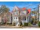 Charming two-story home featuring a cozy front porch, red roof, and well-maintained landscaping at 6 Halsey St, Charleston, SC 29401