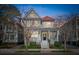 Charming two-story home featuring a cozy front porch, red roof, and well-maintained landscaping at 6 Halsey St, Charleston, SC 29401