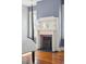 Close-up of bedroom fireplace showing marble mantle, black hearth, and period details at 6 Halsey St, Charleston, SC 29401