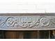 Close-up of decorative carvings on a vintage fireplace, showing intricate floral and geometric patterns at 6 Halsey St, Charleston, SC 29401
