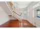 Elegant foyer featuring hardwood floors, a staircase, and a decorative chandelier at 6 Halsey St, Charleston, SC 29401