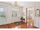 Elegant foyer featuring hardwood floors, a decorative chandelier, and natural light at 6 Halsey St, Charleston, SC 29401