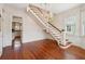 Elegant foyer featuring hardwood floors, a staircase, and a decorative chandelier at 6 Halsey St, Charleston, SC 29401