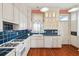 Classic kitchen with white cabinets, blue tile countertops, and a gas range at 6 Halsey St, Charleston, SC 29401