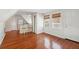 Living room with hardwood floors, natural light, and a kitchen bar area with two chairs at 6 Halsey St, Charleston, SC 29401