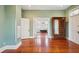Open main bedroom with hardwood floors leading to an ensuite bathroom at 6 Halsey St, Charleston, SC 29401