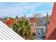 Rooftop view showcasing surrounding buildings and palm trees at 6 Halsey St, Charleston, SC 29401