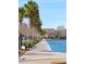 Picturesque view of a sidewalk lined with palm trees near a calm body of water at 6 Halsey St, Charleston, SC 29401