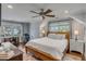 Spacious bedroom boasts hardwood floors, fan, natural light and exercise equipment at 74 6Th Ave, Charleston, SC 29403