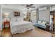 Comfortable bedroom featuring hardwood floors, a ceiling fan, and a window with natural light at 74 6Th Ave, Charleston, SC 29403