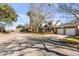 Exterior of a two-story home featuring a well-maintained yard and partial water views from across the street at 74 6Th Ave, Charleston, SC 29403