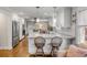 Well-appointed kitchen with stainless steel appliances, granite countertops and hardwood floors at 74 6Th Ave, Charleston, SC 29403