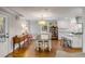 Open-concept kitchen and dining area with modern appliances and hardwood floors at 74 6Th Ave, Charleston, SC 29403