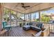 Relaxing screened porch featuring comfortable seating and beautiful water views at 74 6Th Ave, Charleston, SC 29403