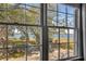 Window view with a scenic water view and beautiful mature trees and landscape at 74 6Th Ave, Charleston, SC 29403