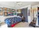 Cozy bedroom featuring a ceiling fan, natural light, and personal decorations at 840 Burger St, Charleston, SC 29407