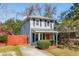 Charming two-story home featuring light gray siding and an inviting red front door at 840 Burger St, Charleston, SC 29407