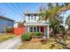 Charming two-story home featuring light gray siding and an inviting red front door at 840 Burger St, Charleston, SC 29407