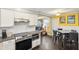 Open kitchen with modern appliances that flows into a light-filled living area at 840 Burger St, Charleston, SC 29407
