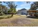 Spacious backyard featuring a pool, lounge chairs, and outdoor covered kitchen area at 8834 Palmetto Rd, Edisto Island, SC 29438