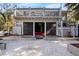 Backyard view with a screened-in porch below and a spacious deck above, perfect for outdoor relaxation at 8834 Palmetto Rd, Edisto Island, SC 29438