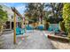 Charming backyard featuring multiple swing sets for relaxing and enjoying the outdoors at 8834 Palmetto Rd, Edisto Island, SC 29438