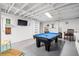 Finished basement with pool table, creating a great recreational space for entertainment and relaxation at 8834 Palmetto Rd, Edisto Island, SC 29438