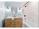 Bathroom features a wood vanity with a white countertop and a tub with a shower at 8834 Palmetto Rd, Edisto Island, SC 29438