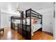 Bunk room includes two bunk beds with ceiling fan and views from the window at 8834 Palmetto Rd, Edisto Island, SC 29438