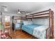 Bedroom featuring two sets of bunk beds, with ocean-themed bedding and decor at 8834 Palmetto Rd, Edisto Island, SC 29438