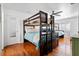 Shared bunk room with two sets of dark wood bunk beds and light blue quilts at 8834 Palmetto Rd, Edisto Island, SC 29438