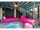 Fun bedroom with two swinging beds, bright colors, and unique decor for a playful, relaxing space at 8834 Palmetto Rd, Edisto Island, SC 29438